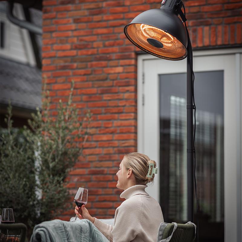 Woman sitting under the lamp 