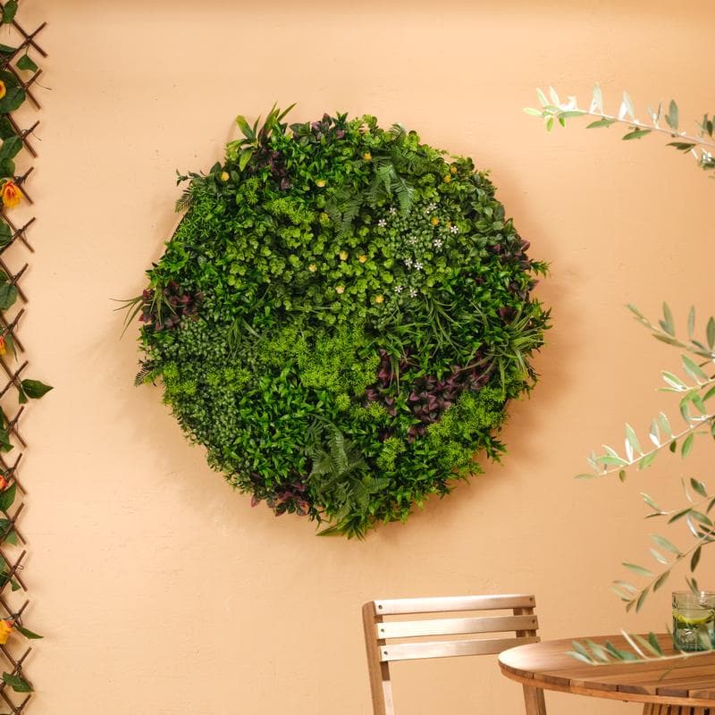 Décoration murale ronde avec plantes artificielles
