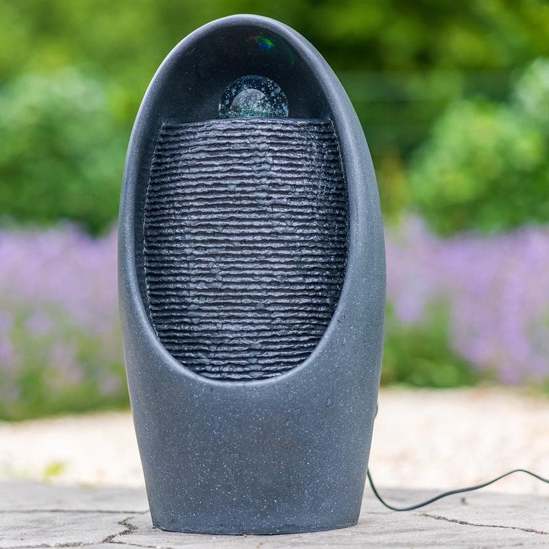 Fontein met lichteffect en draaiende bol