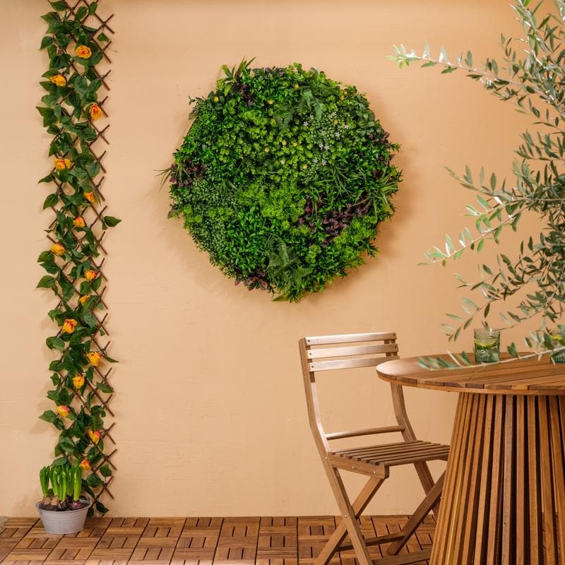 Décoration murale ronde avec plantes artificielles