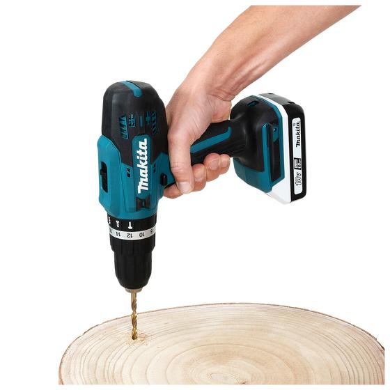 The Makita cordless saw and drill in use on wood