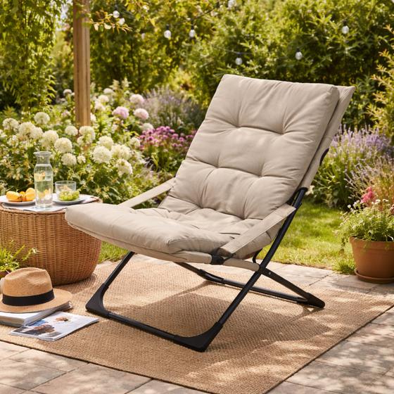 Lounge chair with cushion in the garden – lifestyle image