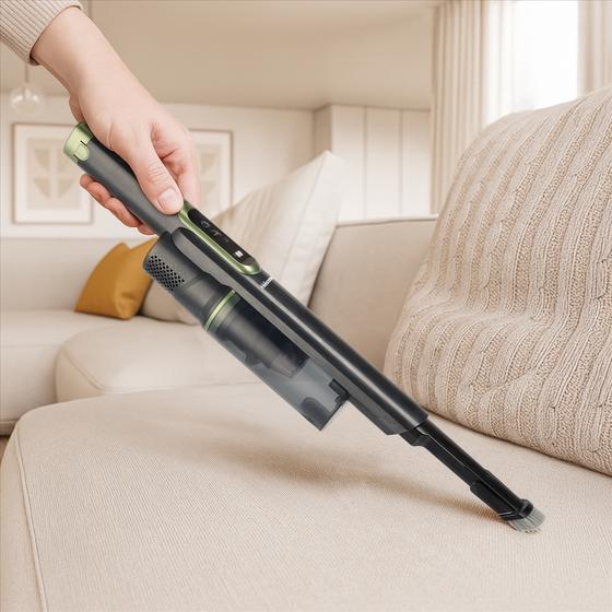 Tristar cordless vacuum cleaner with charging station - vacuuming couch