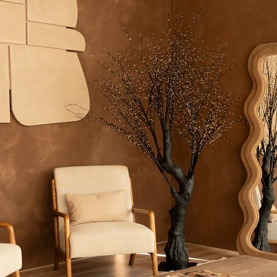 Light tree with gold-coloured LED lights - switched on in the living room