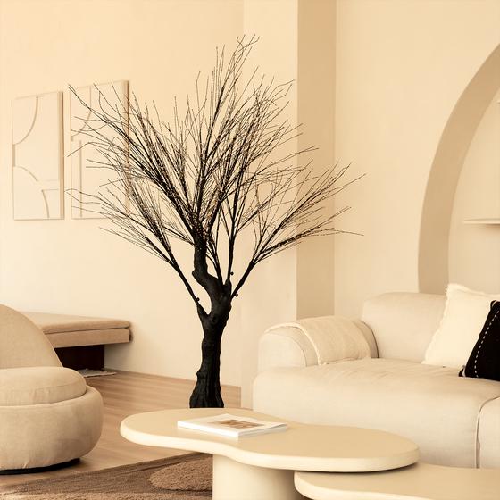 Light tree with gold-coloured LED lights - in living room with lights switched off