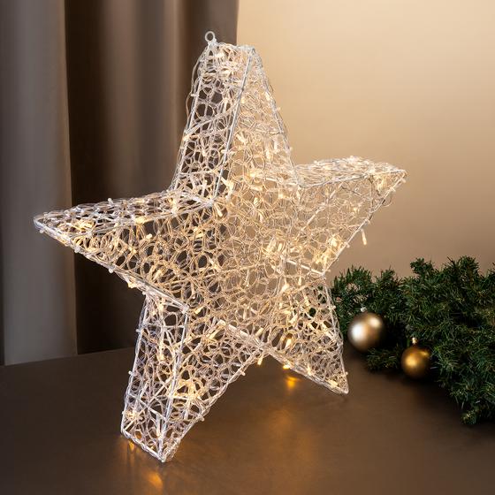 Étoile de Noël 120 LED 58 cm allumée sur une table