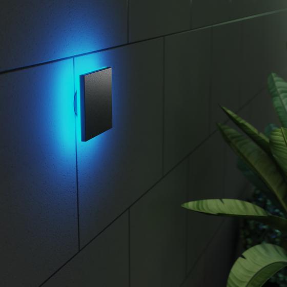 LSC Smart Connect outdoor wall lamp on the wall with blue light