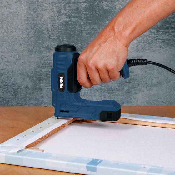 FERM staple and nail gun - in use on a frame