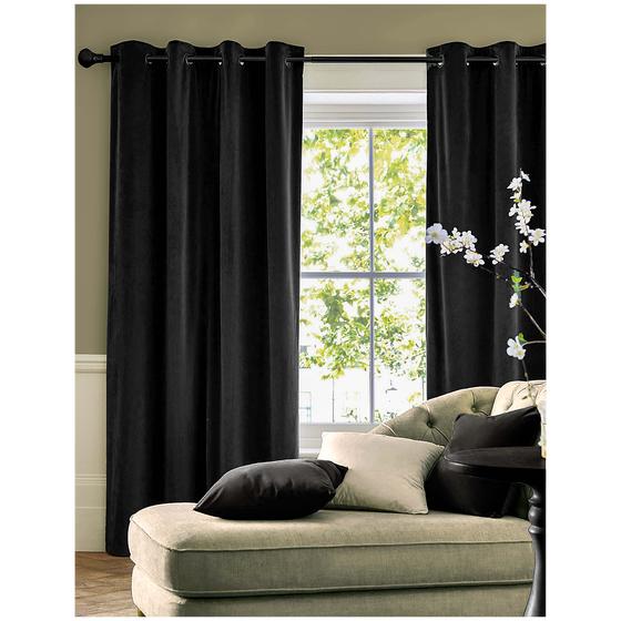 Velvet curtains hung black in the living room