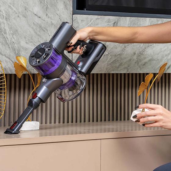 Wipe the sideboard with the Hyundai upright vacuum cleaner