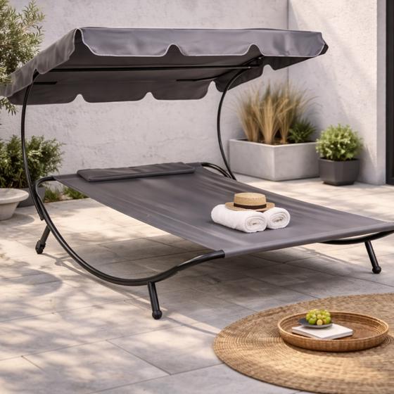 Double lounge bed with canopy in garden