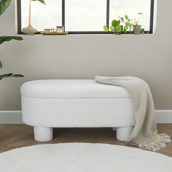 Teddy storage bench in bedroom with throw