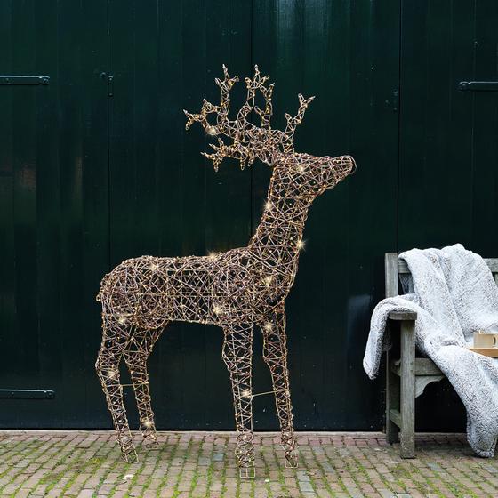Rattan reindeer with LED lights - in the garden
