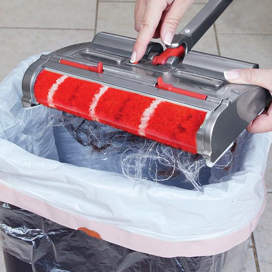 Emptying Voom SpinSweep cordless sweeper