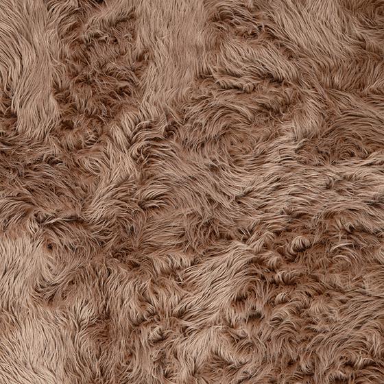 Brown high-pile rug - extreme close-up of material