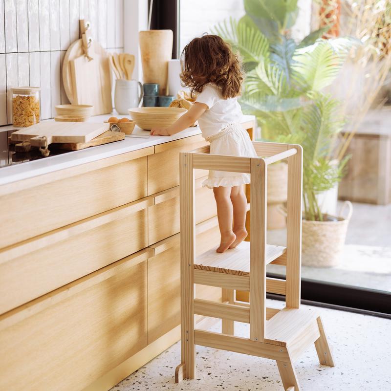 Wooden learning tower - in the kitchen