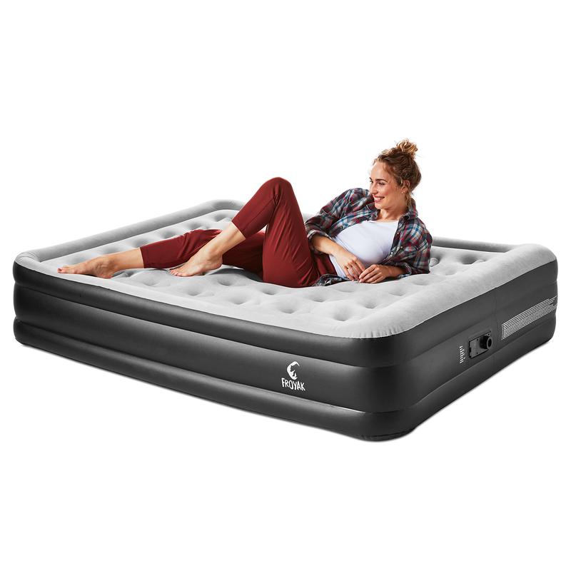 Double airbed with built-in pump - woman lying on bed angle view