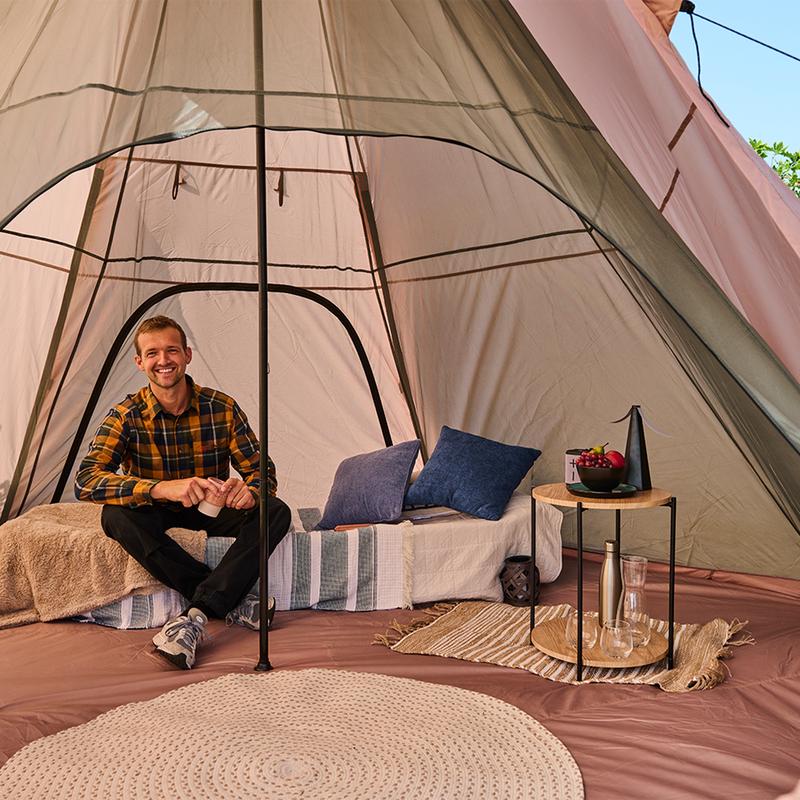 Glamping tipi tent - inside with person