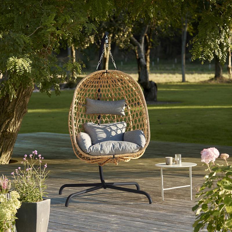 Hanging chair - in garden by tree