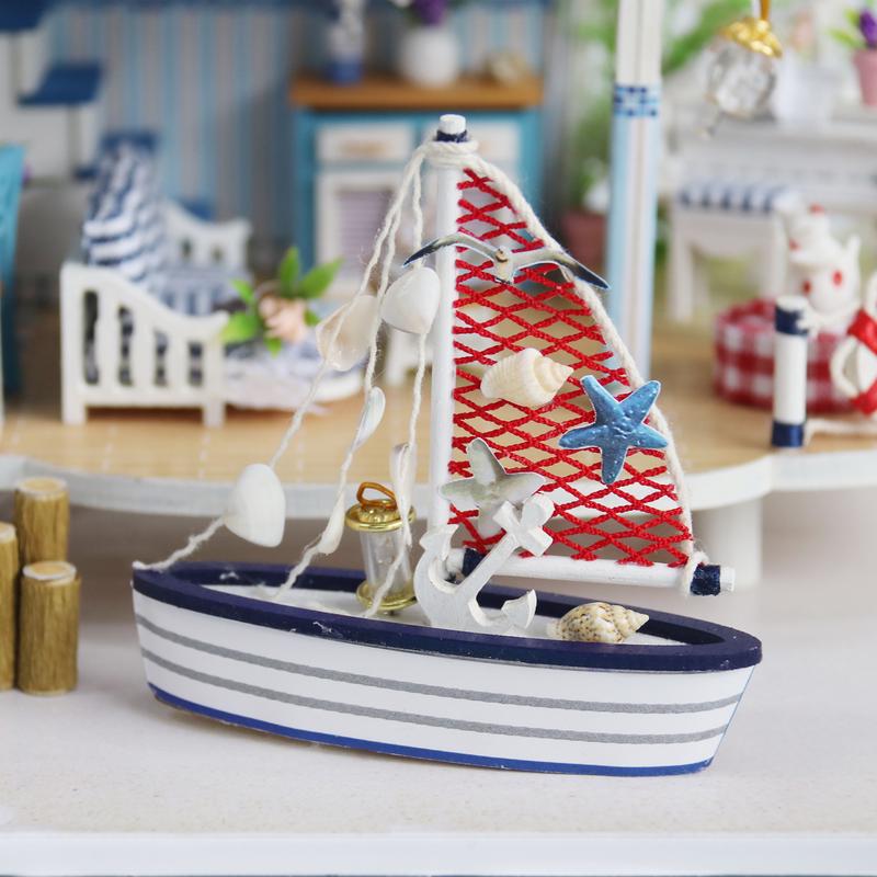 Miniature beach house sail boat