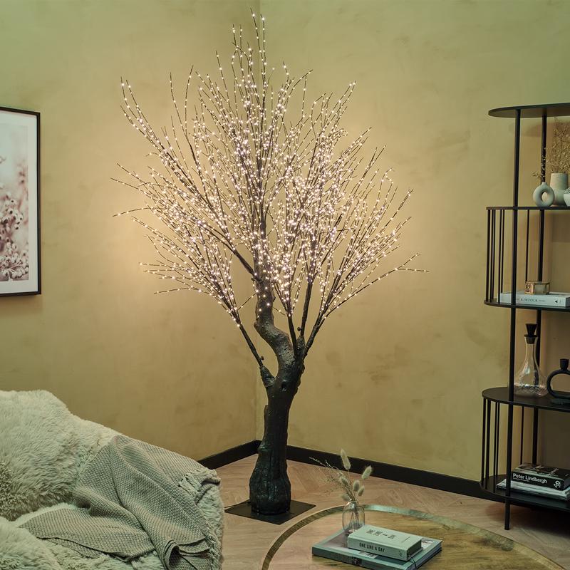 Light tree with gold-coloured LED lights - in corner of living room