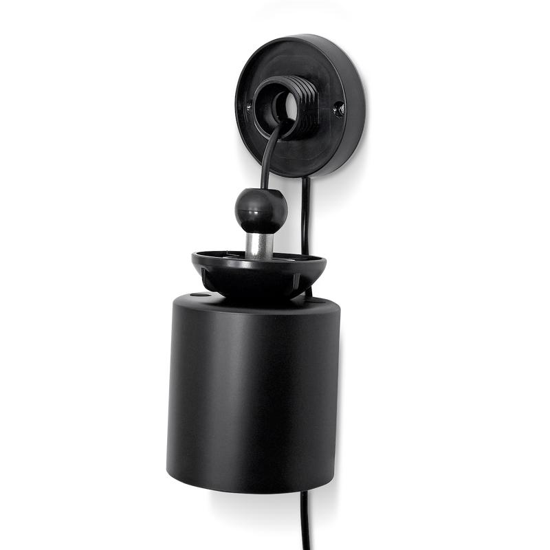Caméra de surveillance fixée au mur