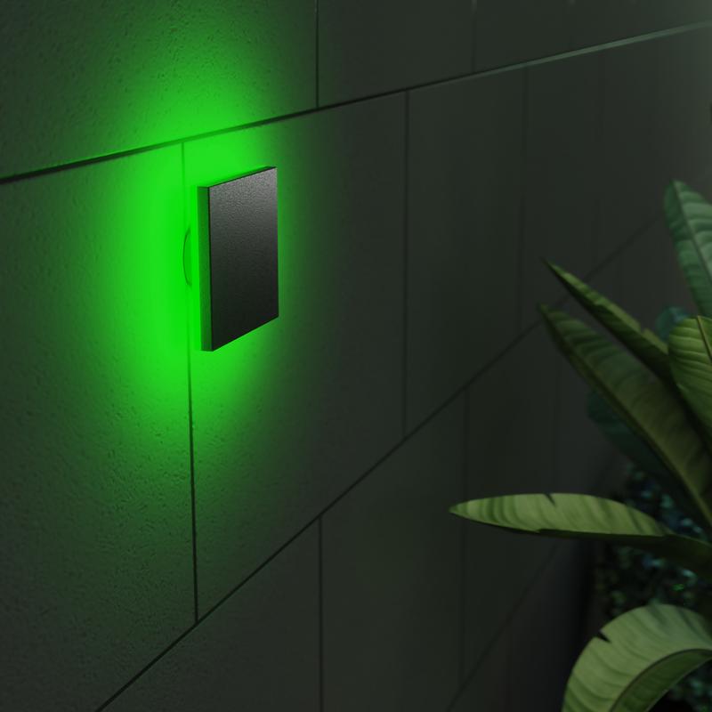 LSC Smart Connect outdoor wall lamp on the wall with green light