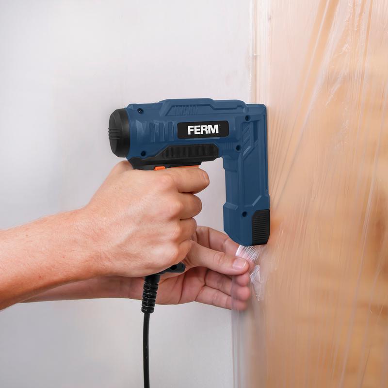 FERM staple and nail gun - in use on a wall
