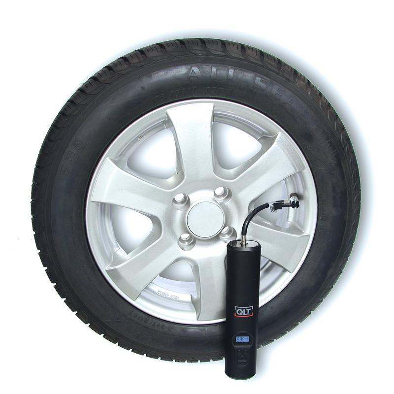 Cordless air compressor attached to a car tyre