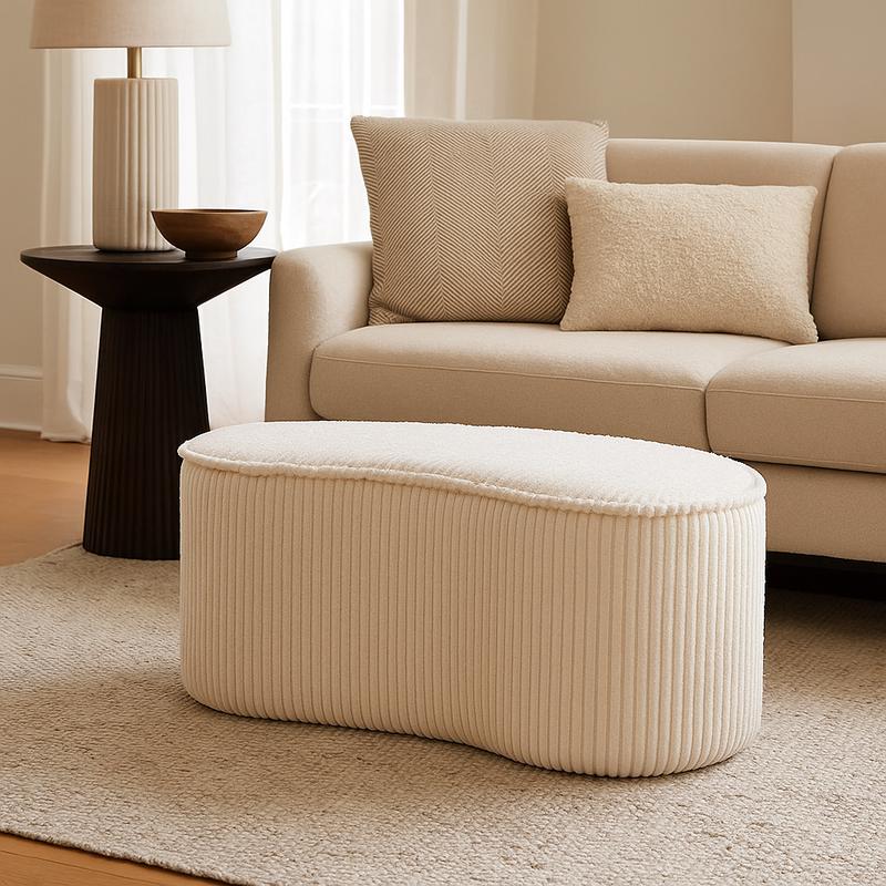 Cream white ribbed pouffe in living room