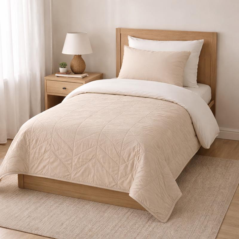 Bedspread and duvet cover set on single bed