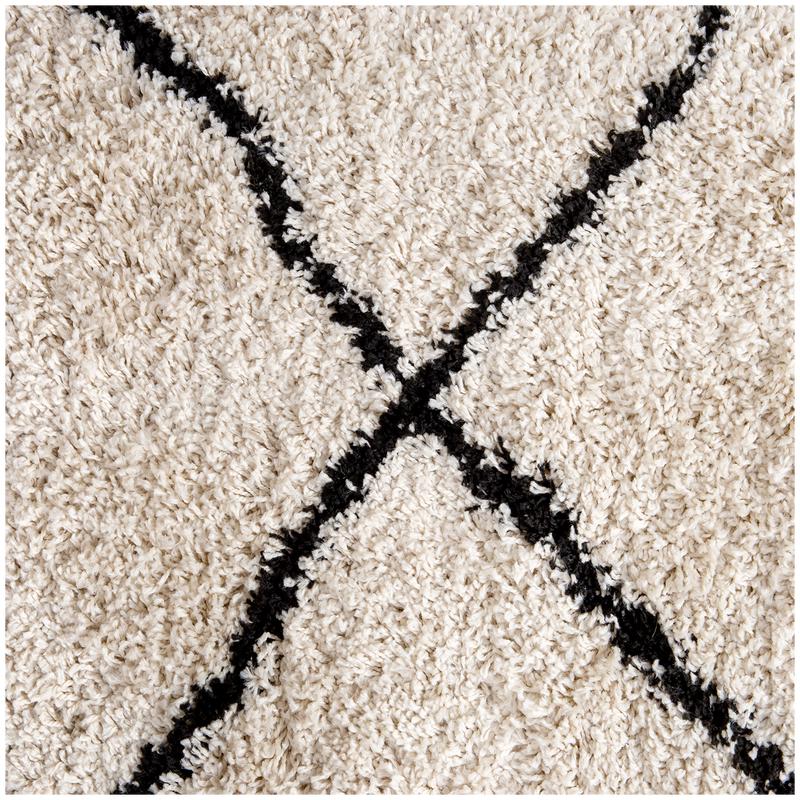 Close up of the Cream rug with chequered pattern