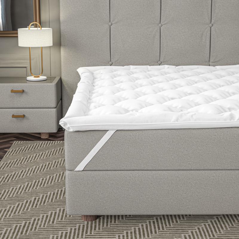 Premium mattress overlay on bed with elastic