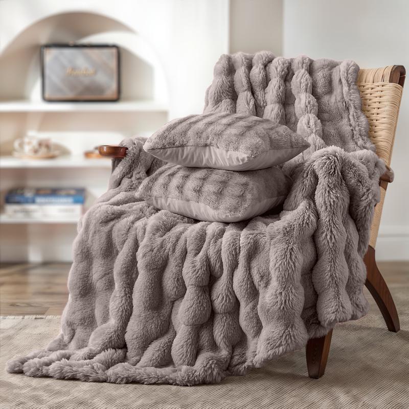 Pompom Fur throw with cushions – taupe – on chair