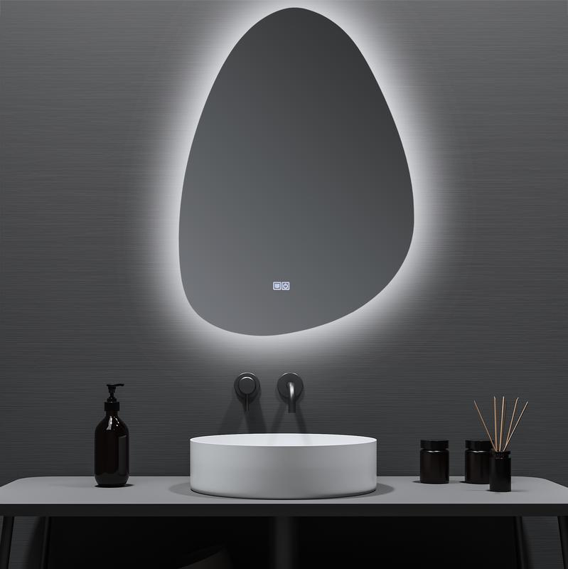 Asymmetric mirror with LED lighting close up above washbasin