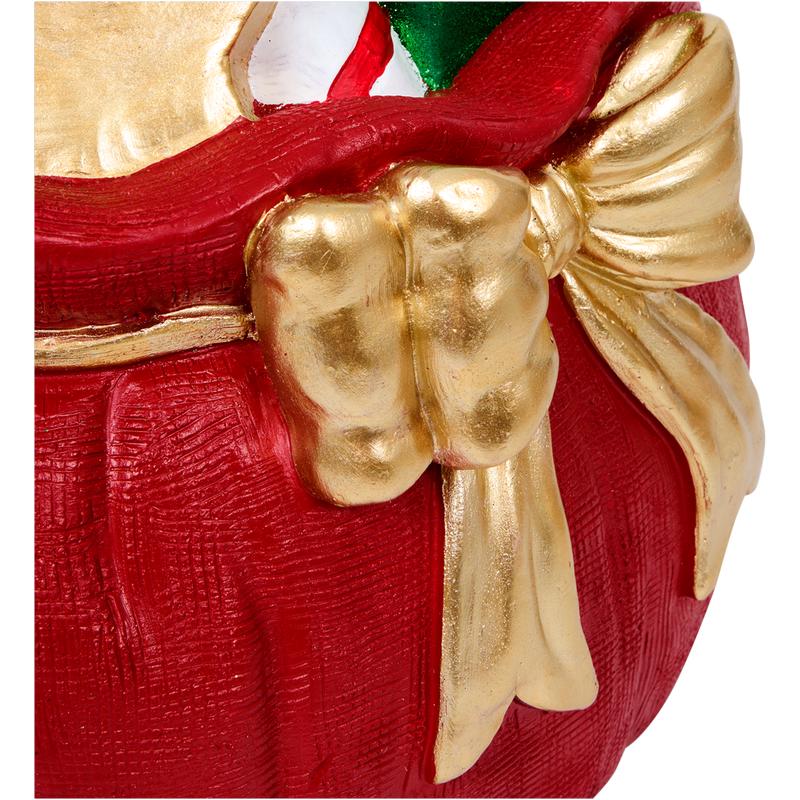 Christmas tree stand bag with presents – close-up of bow